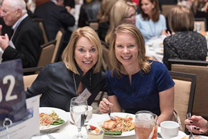 two woman at a dinner table